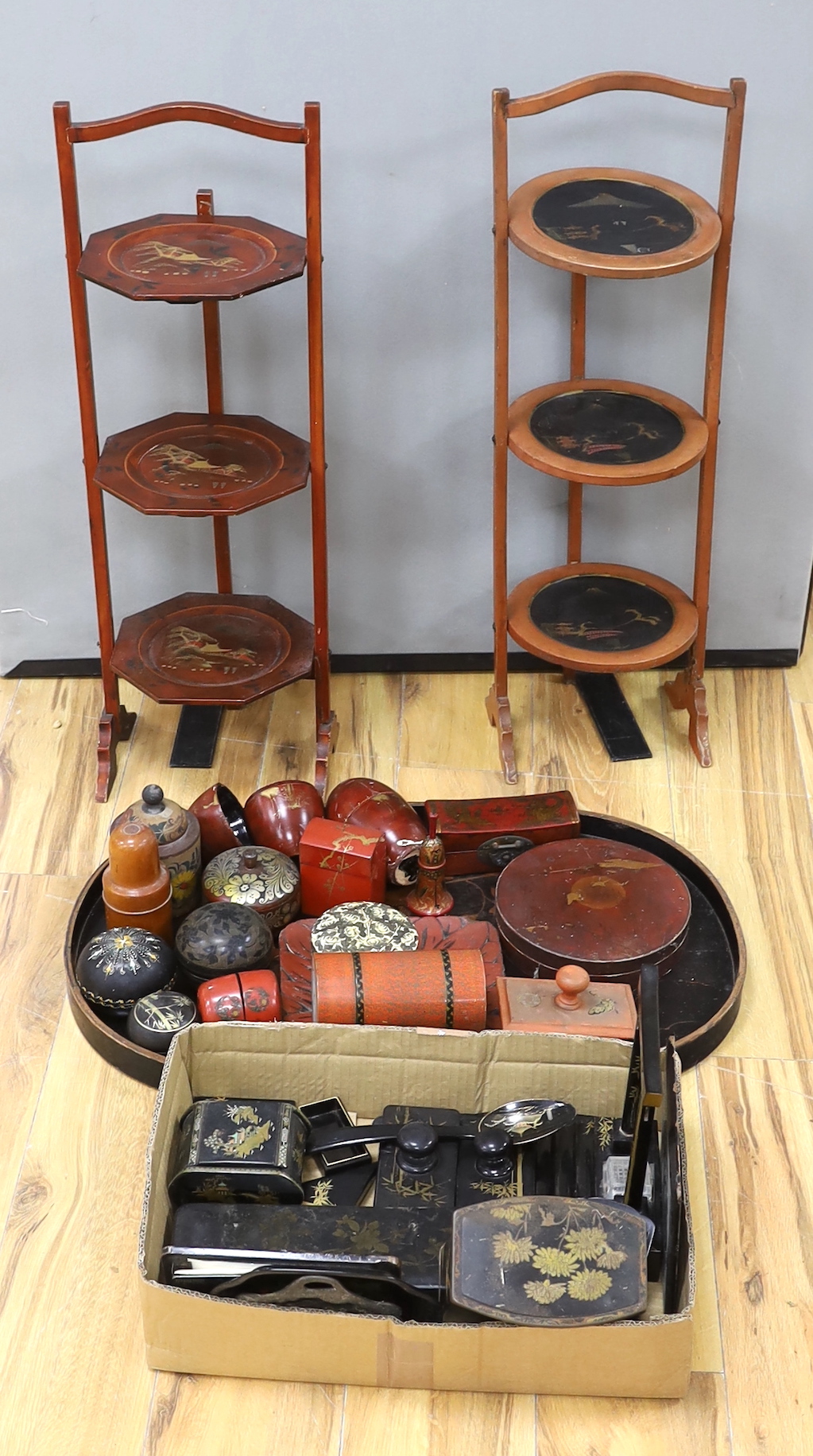 Two chinoiserie lacquer cake stands, a large lacquer tray, a quantity of boxes, blotters, an ink stand, tins etc